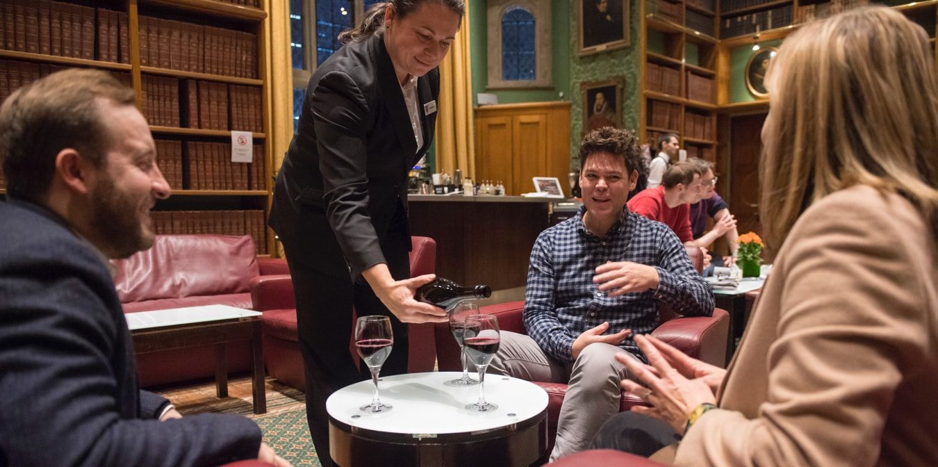 Group of people having wine at the mcr